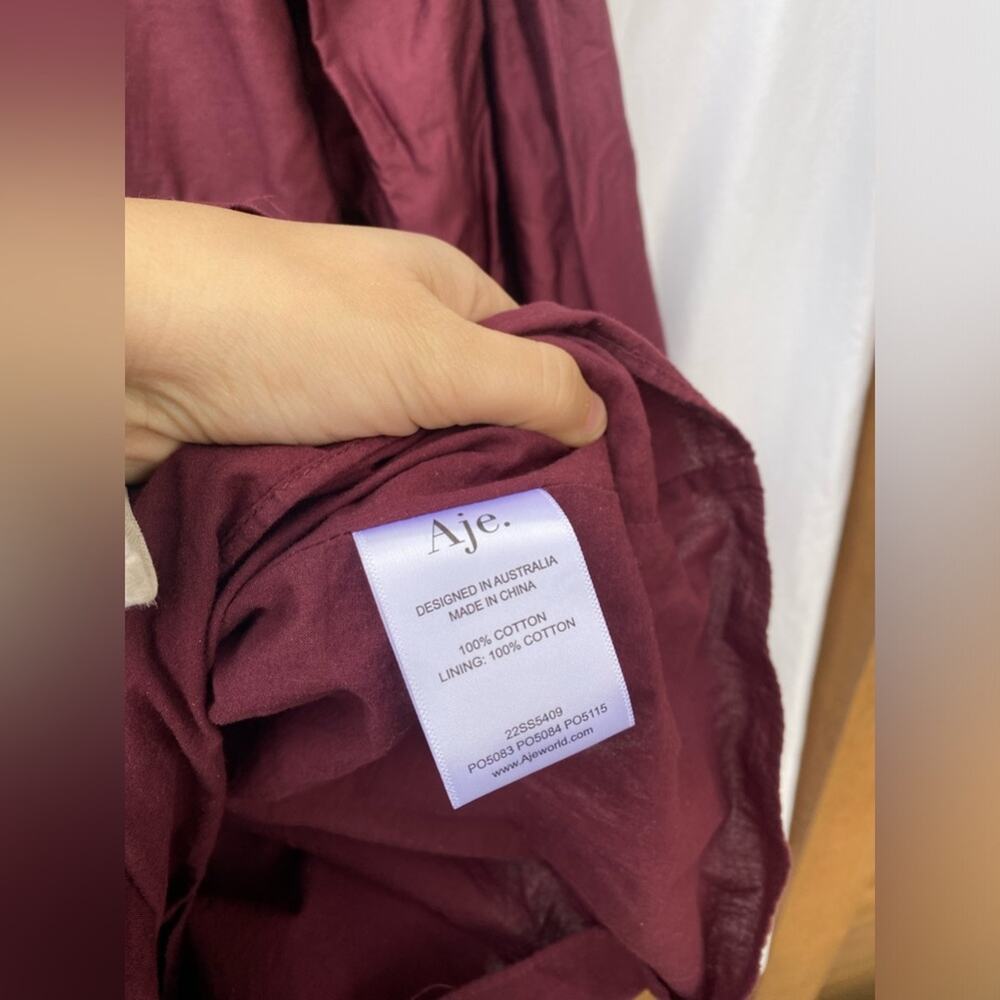 Aje. Wine red tiered zip Francis Mini Dress - Picture 8 of 9